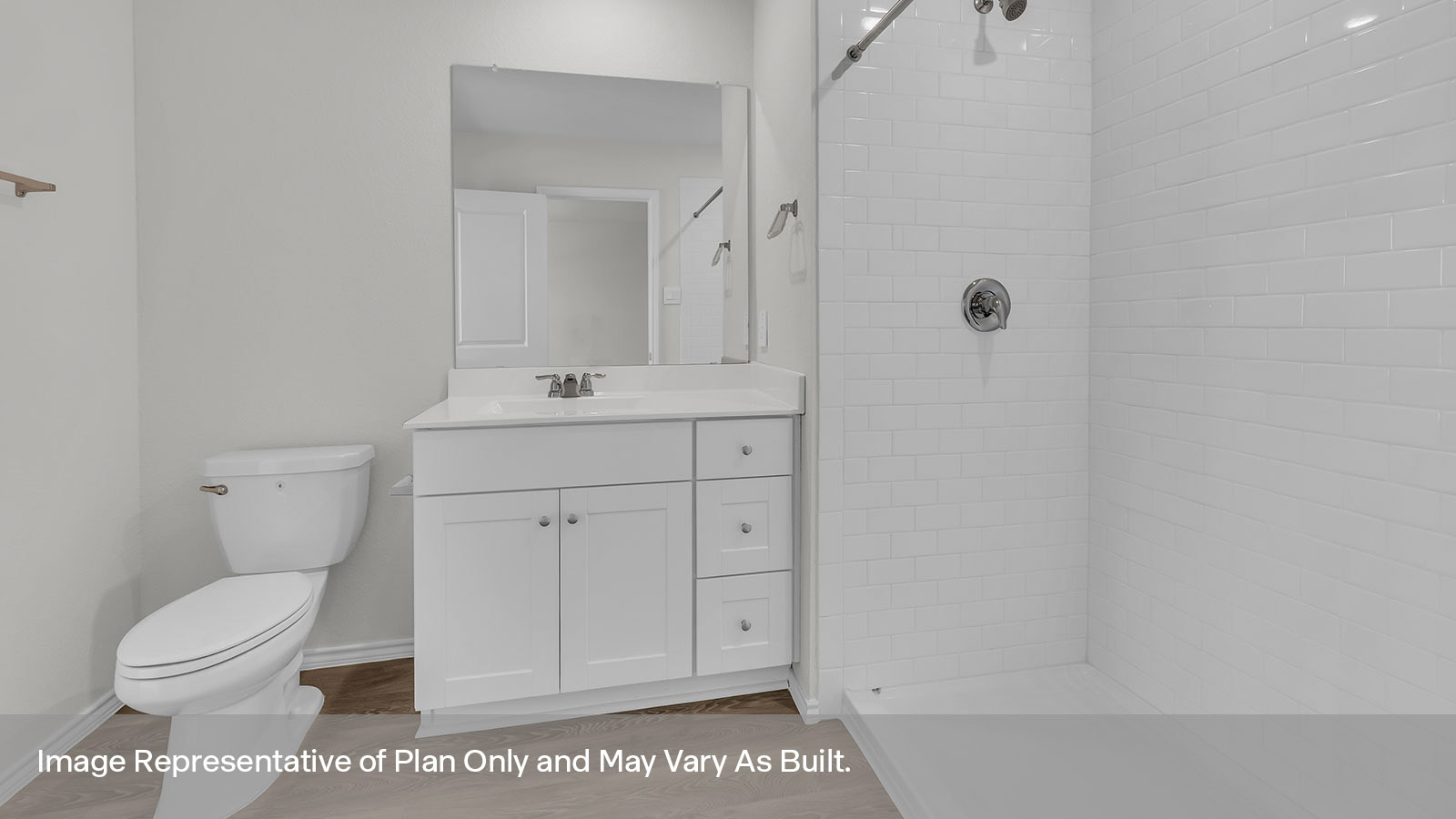 Main bathroom with toilet, walk-in shower, and vanity.