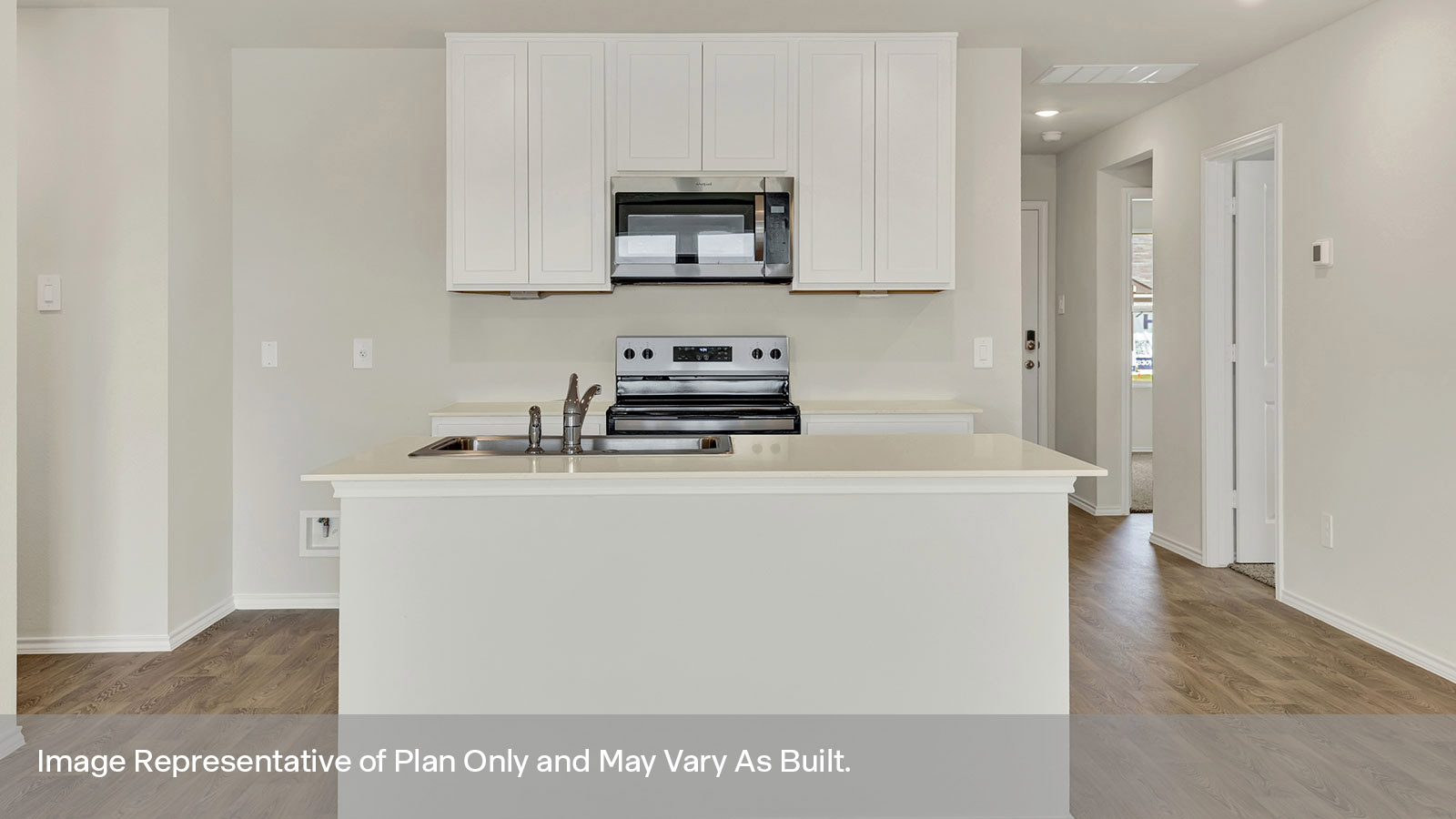 Kitchen with kitchen island and white cabinets.