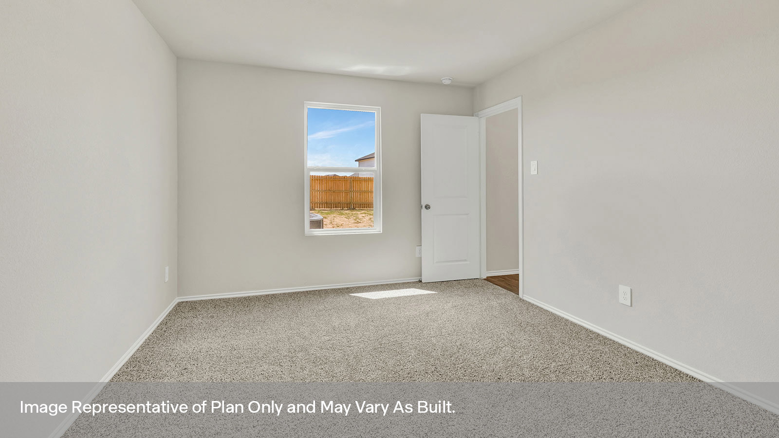 Main bedroom with carpeting and one window.