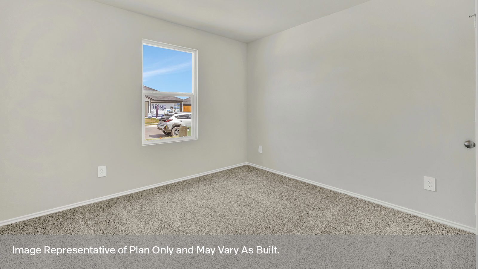 Front bedroom with carpeting and one window.