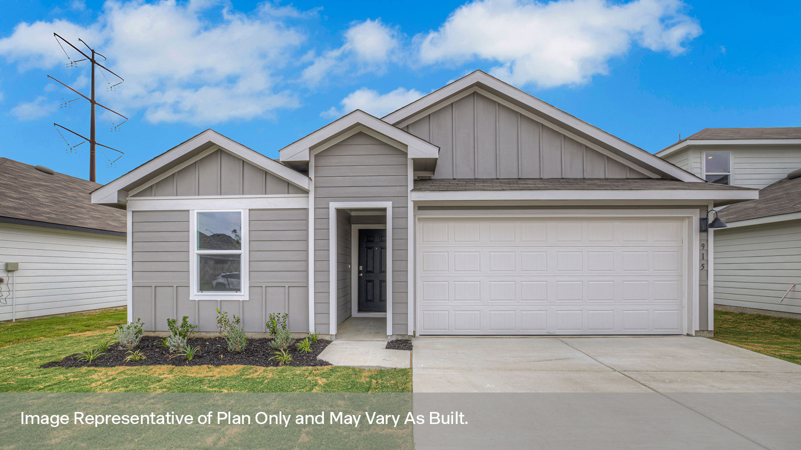 Single-story farmhouse with 2 car garage.