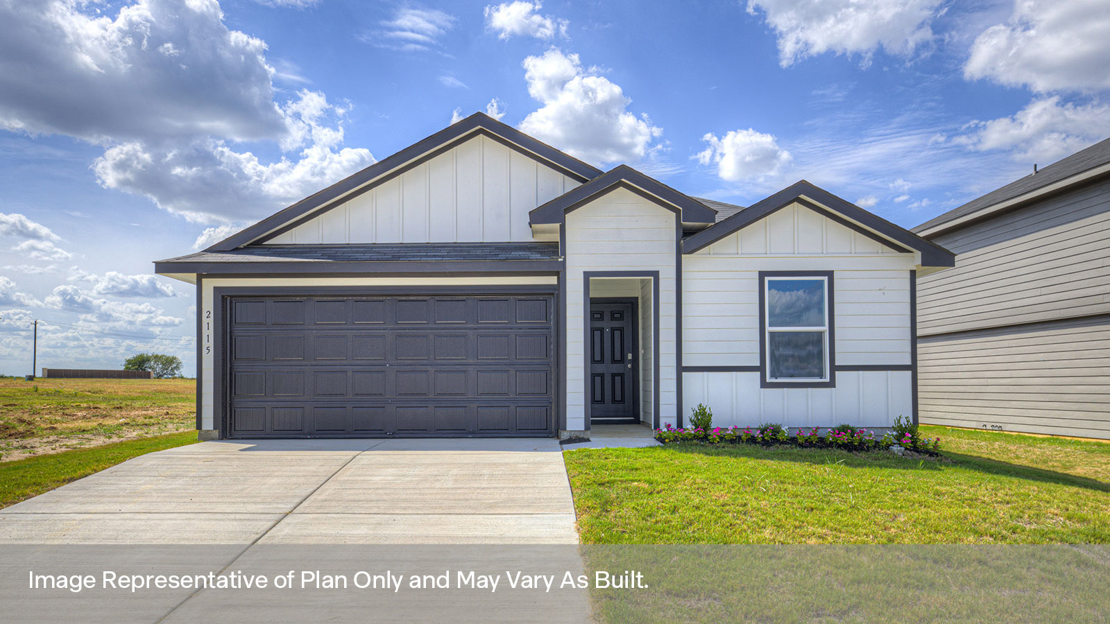 Single-story farmhouse with 2 car garage.