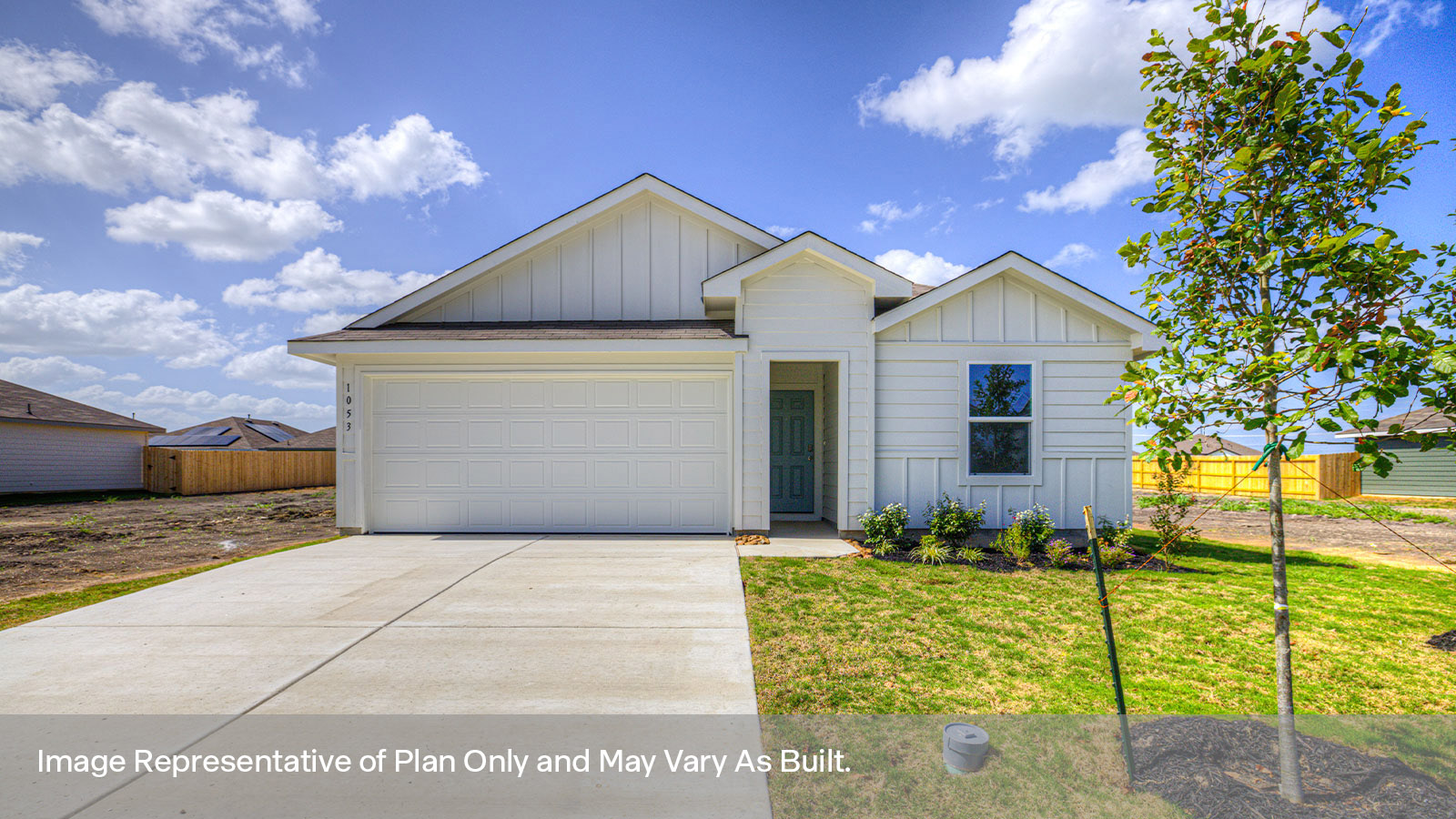 Single-story farmhouse with 2 car garage.