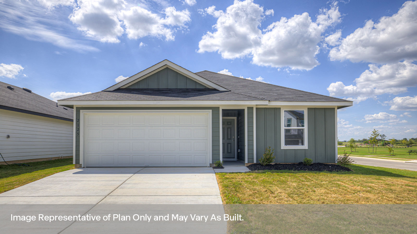 Single-story farmhouse with 2 car garage.