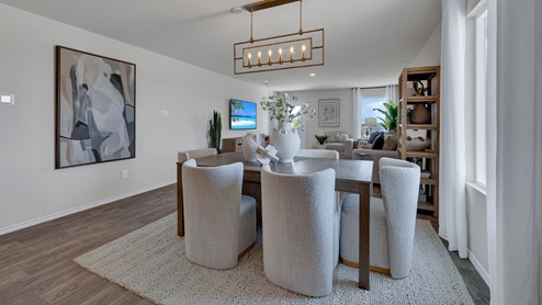 Dining room with vinyl flooring and one window.