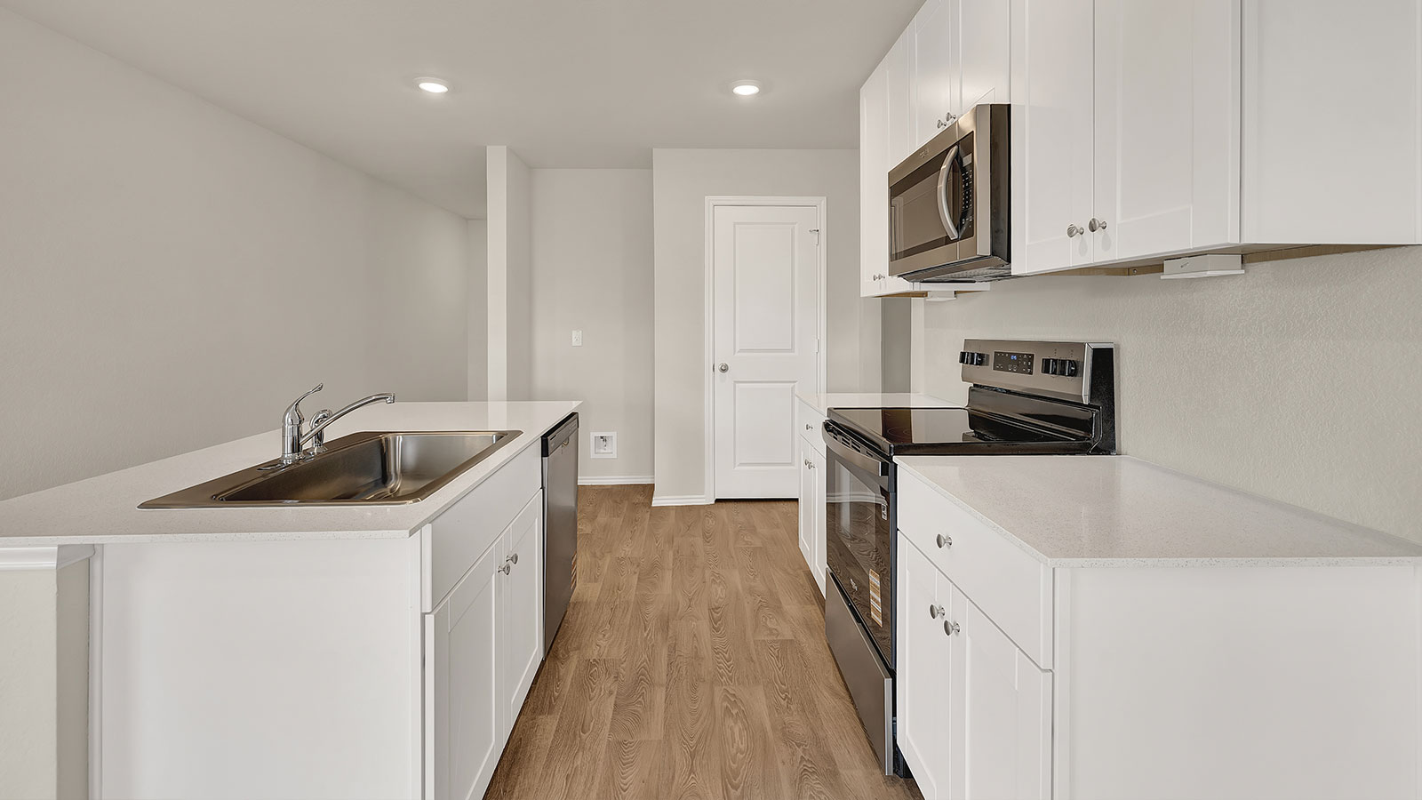 Kitchen with kitchen island and quartz countertops.