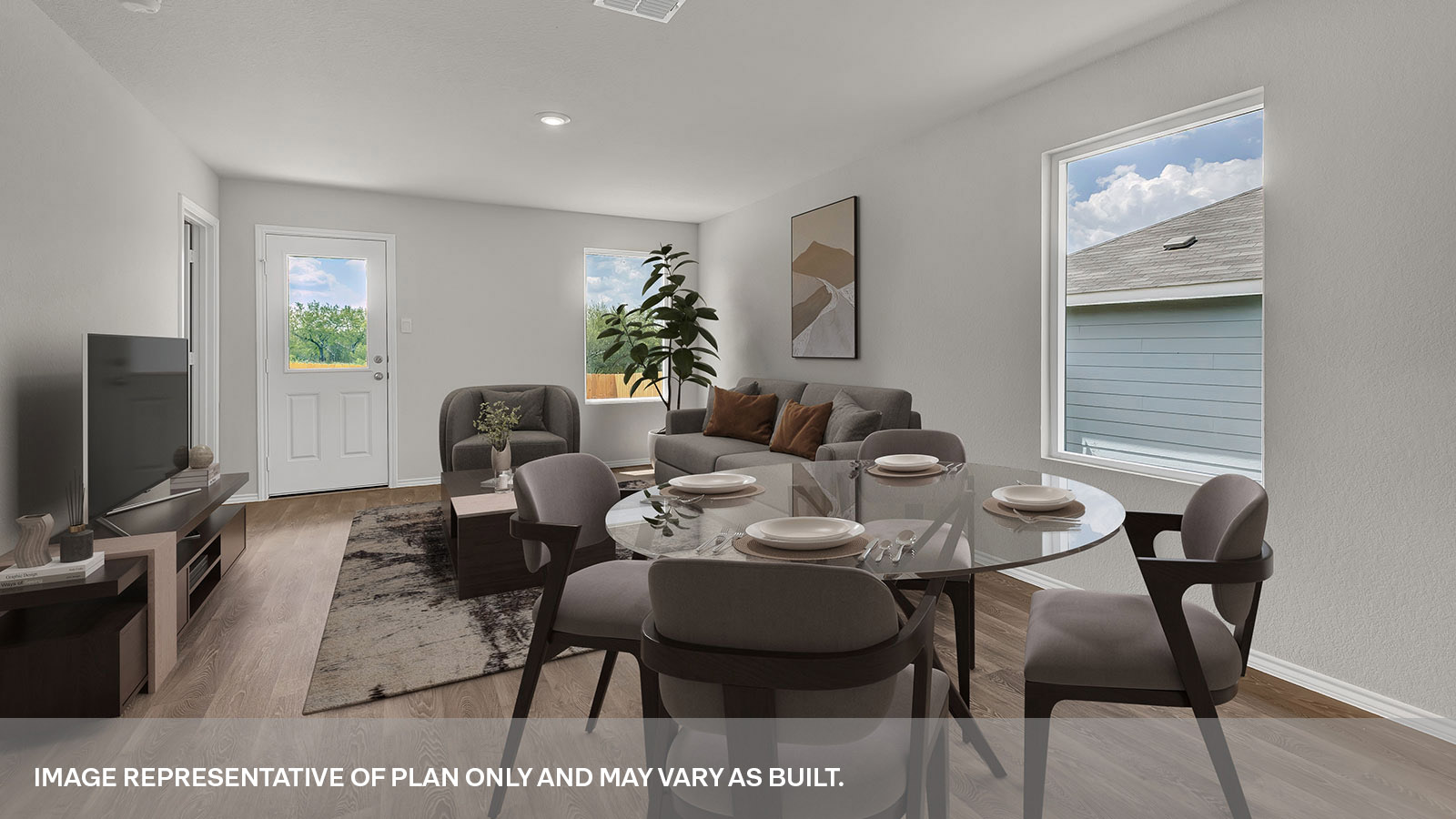 Dining room and living room with vinyl flooring, 2 windows, and a half lite exterior door.
