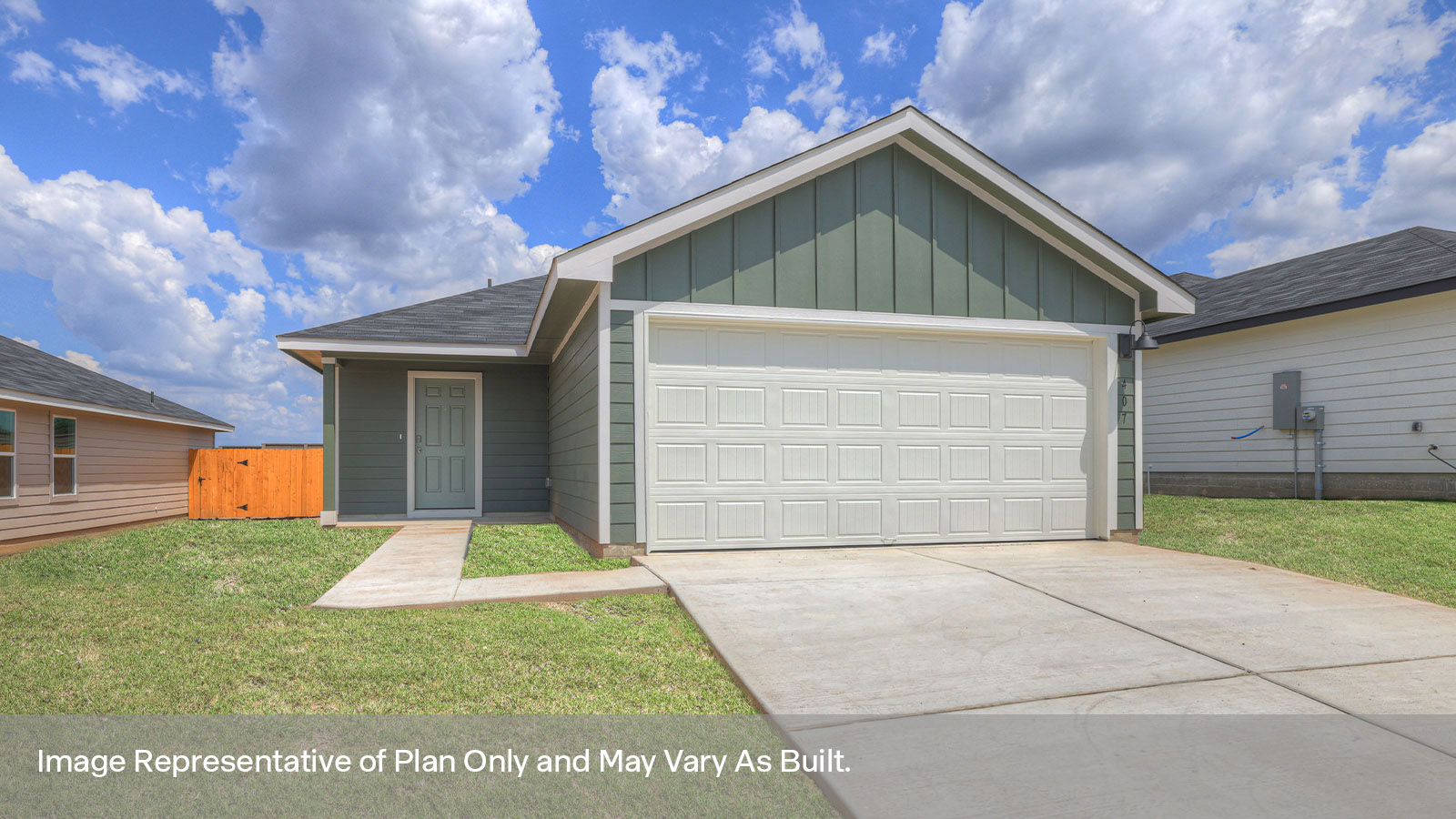 Single-story farmhouse exterior with a 2 car garage.