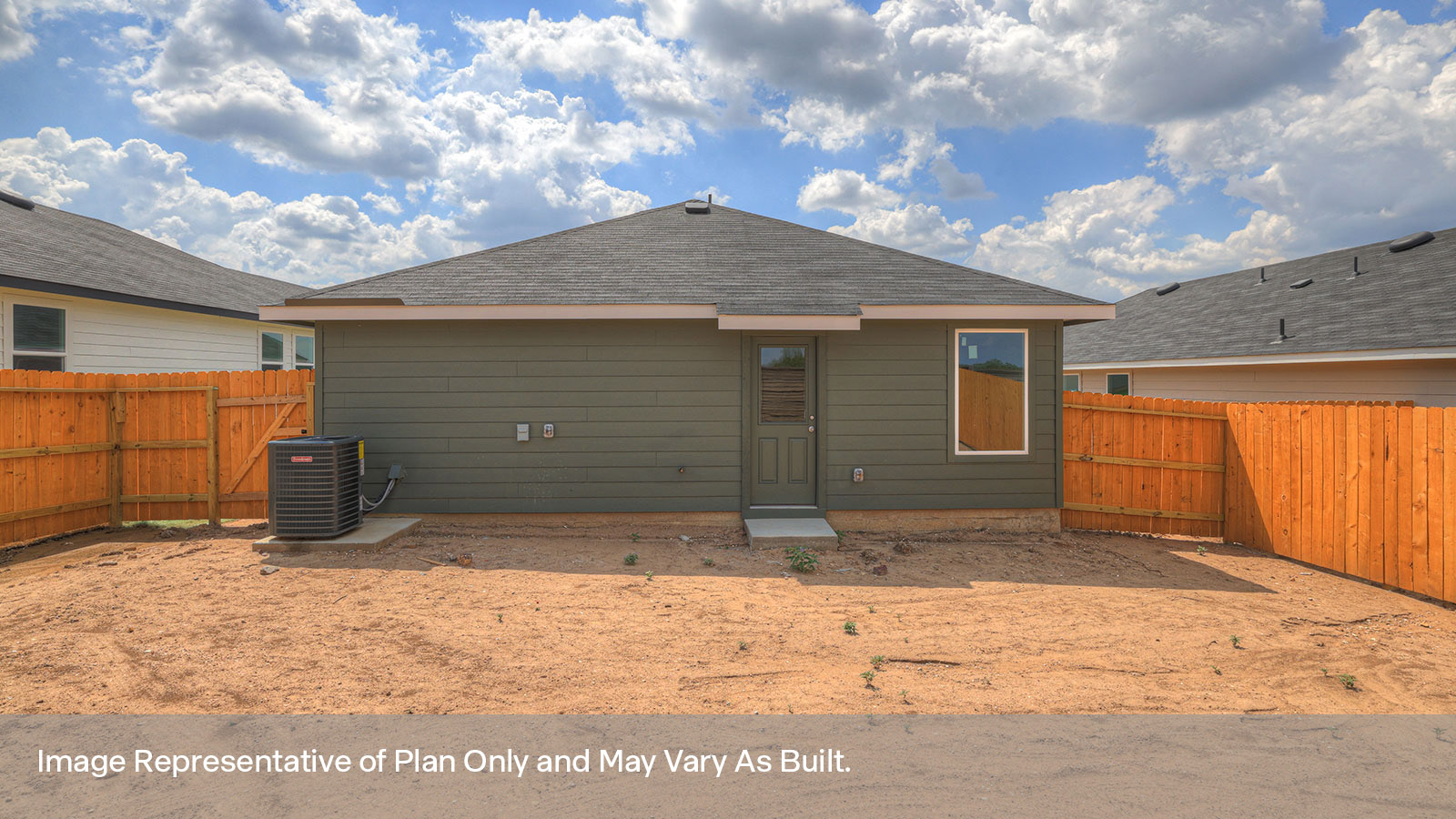 Backyard with sod and privacy fence.