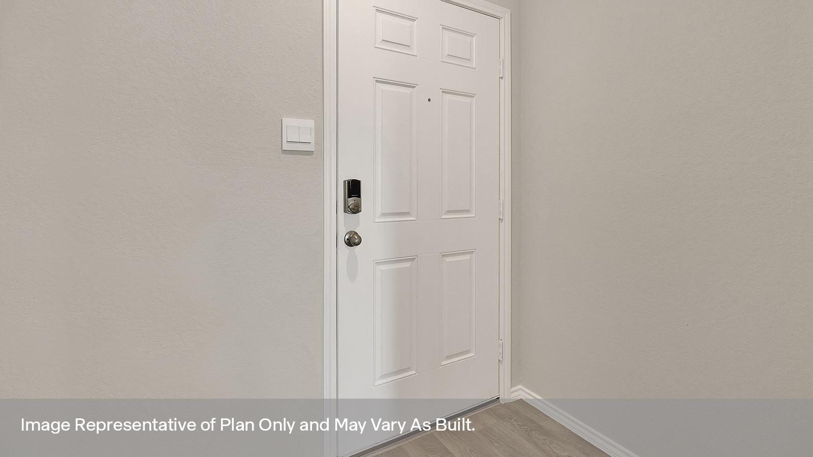 Entryway with vinyl flooring and front door.