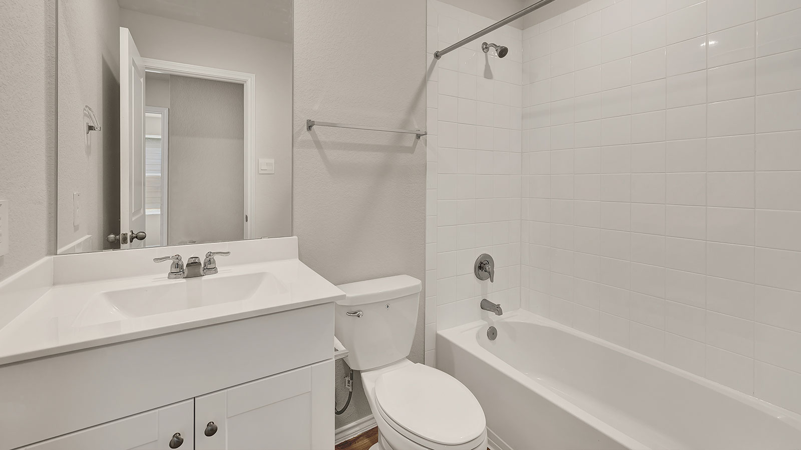 bath 2 with a single vanity, toilet, shower and tub combo