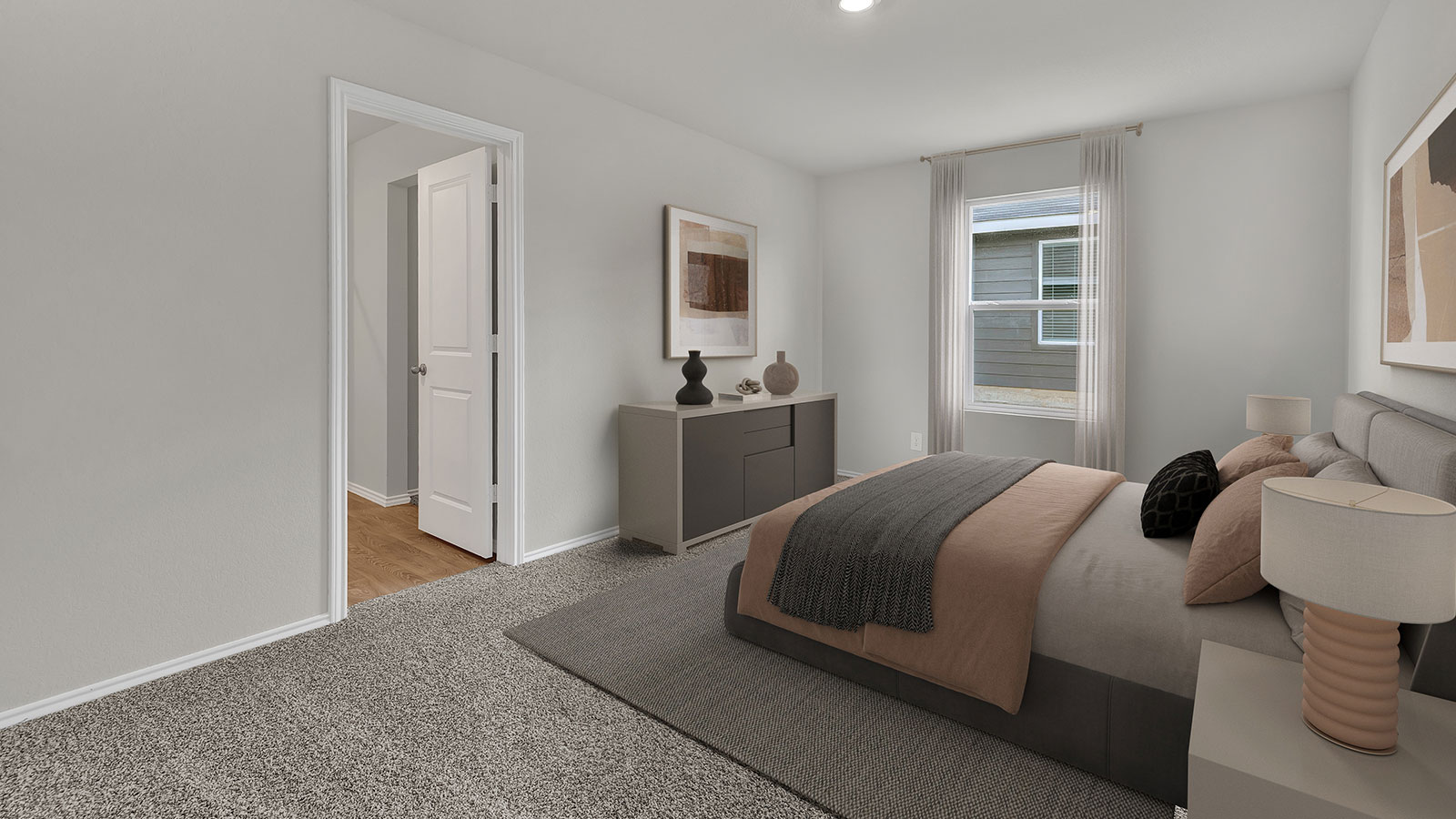 Main bedroom with carpeting and doorway.