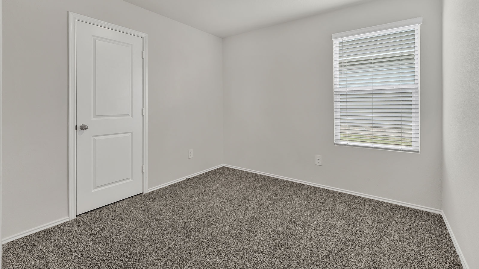 Secondary bedroom with carpeting and one window.