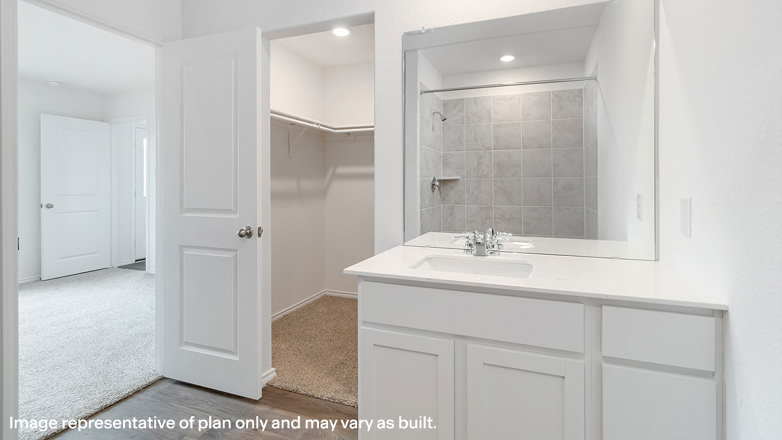 Main bathroom with single sink vanity and closet entry.