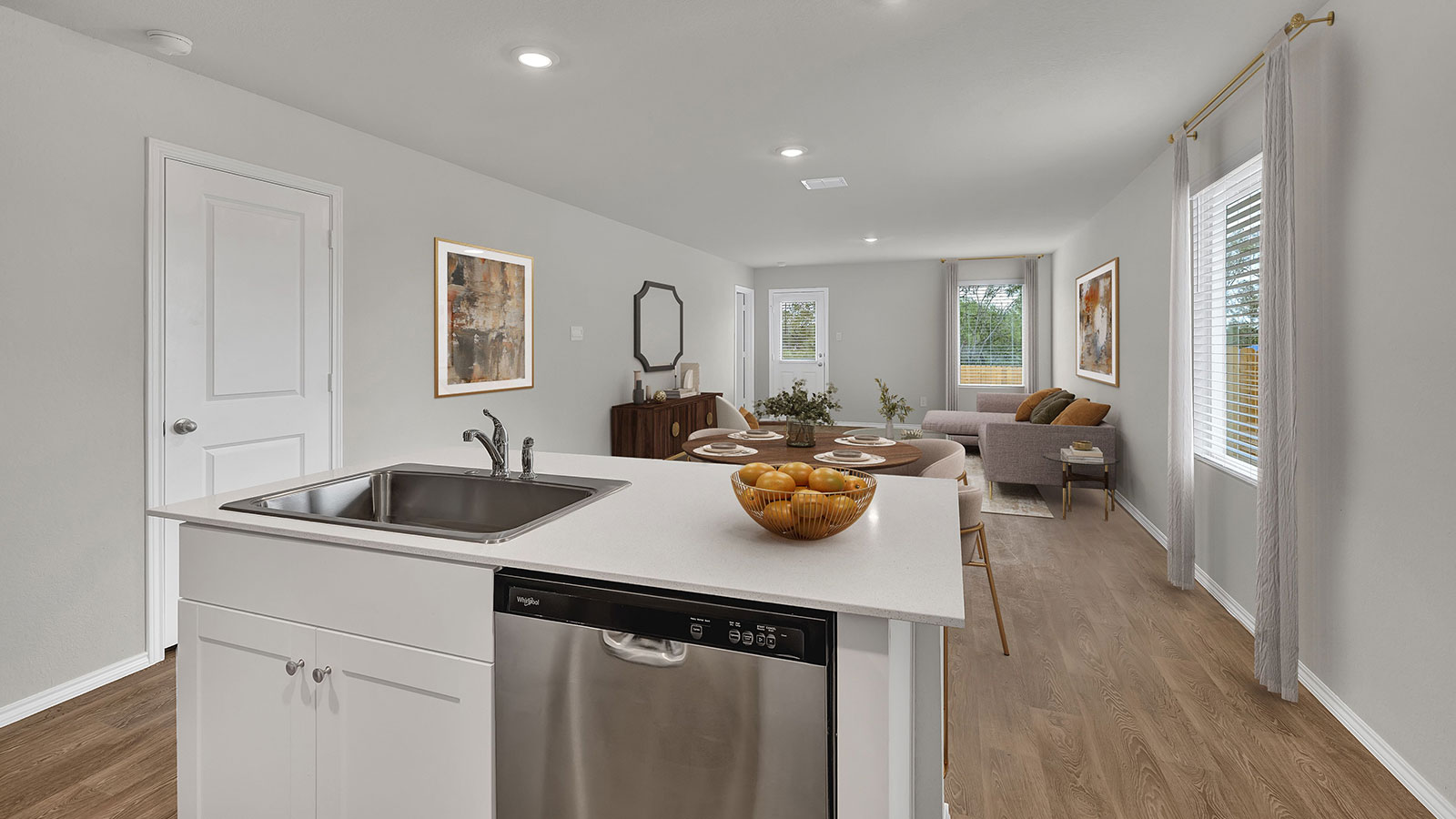 Kitchen with kitchen island and quartz countertops.