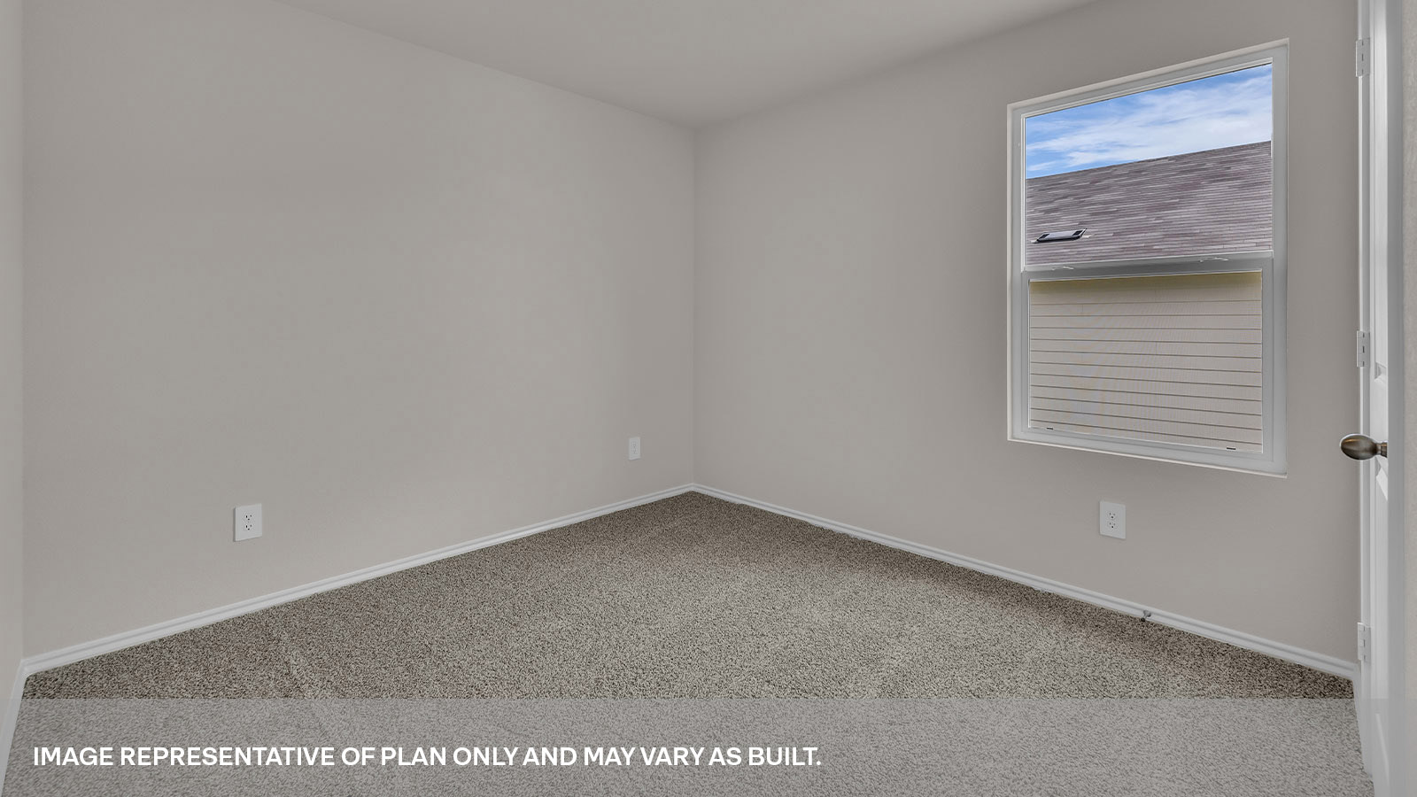 Bedroom with carpeting and one window.