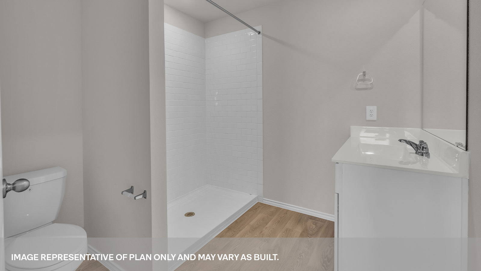 Main bathroom with single sink vanity, toilet, and walk in shower.