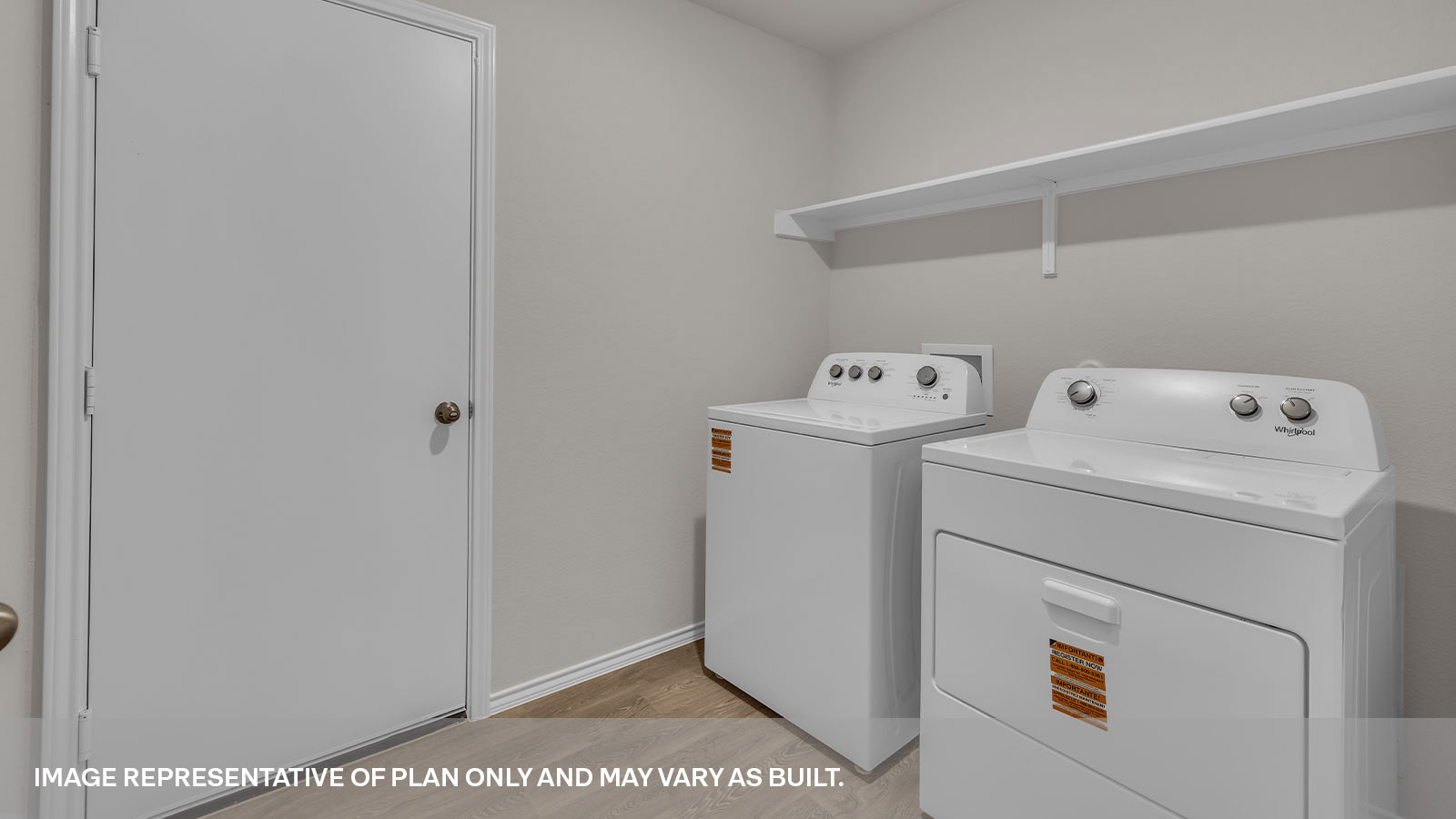 Utility room with washer/dryer connections and wooden shelving.