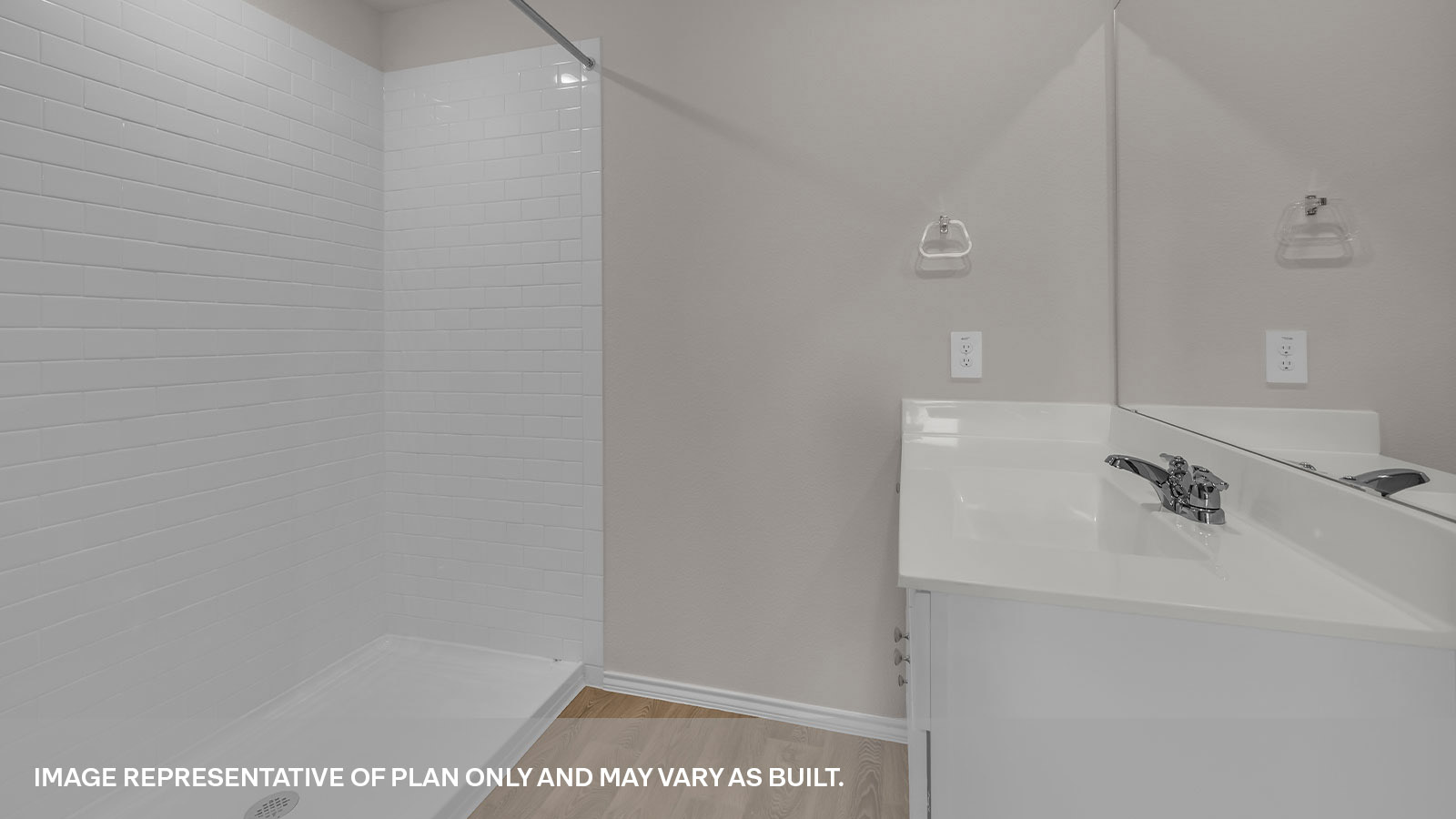 Main bathroom with vanity, toilet, and shower with tile.