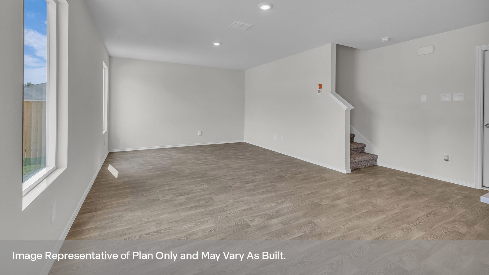Living room with vinyl flooring, one window, and a half lite exterior door.