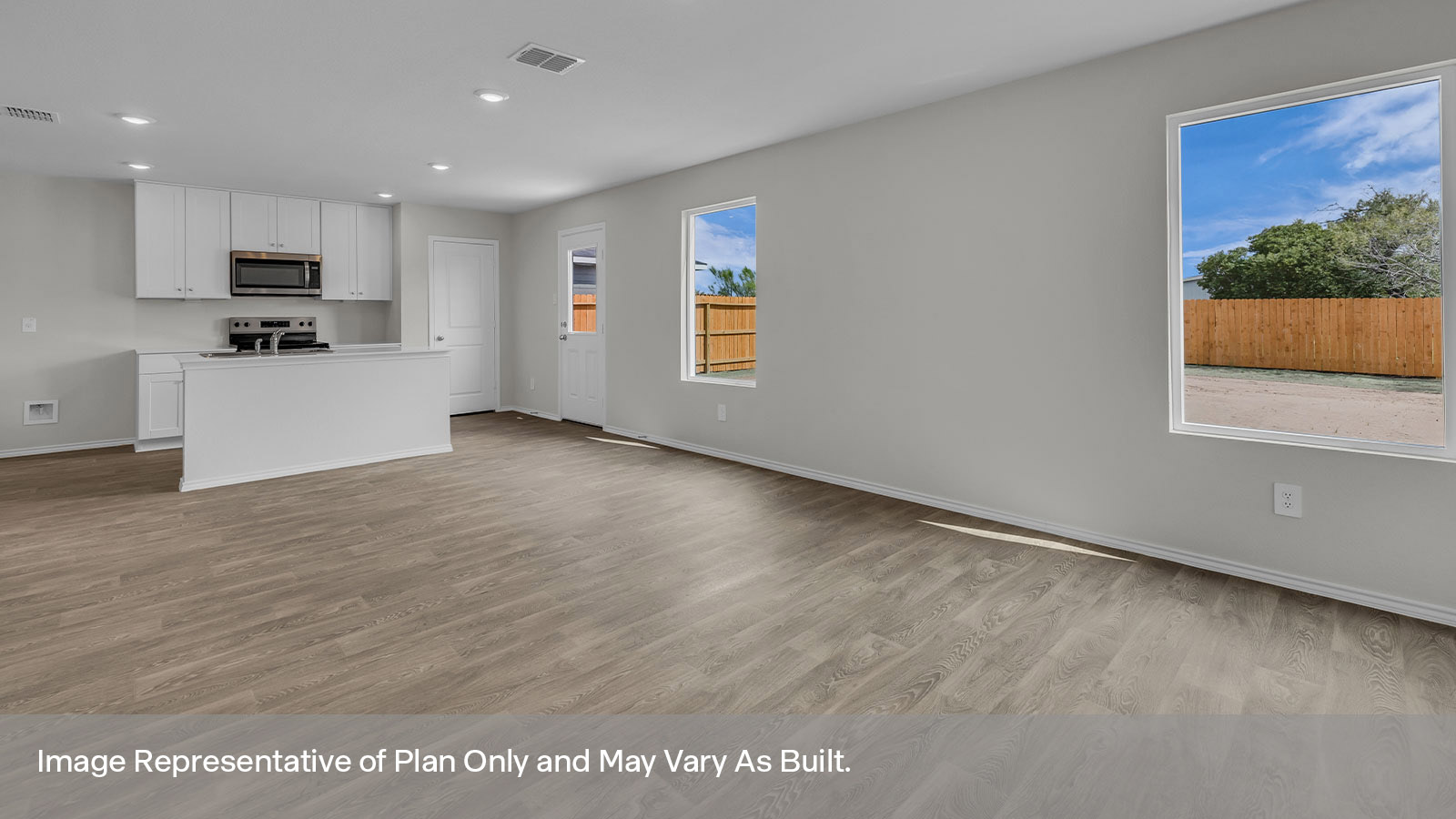 Living room with vinyl flooring, one window, and a half lite exterior door.