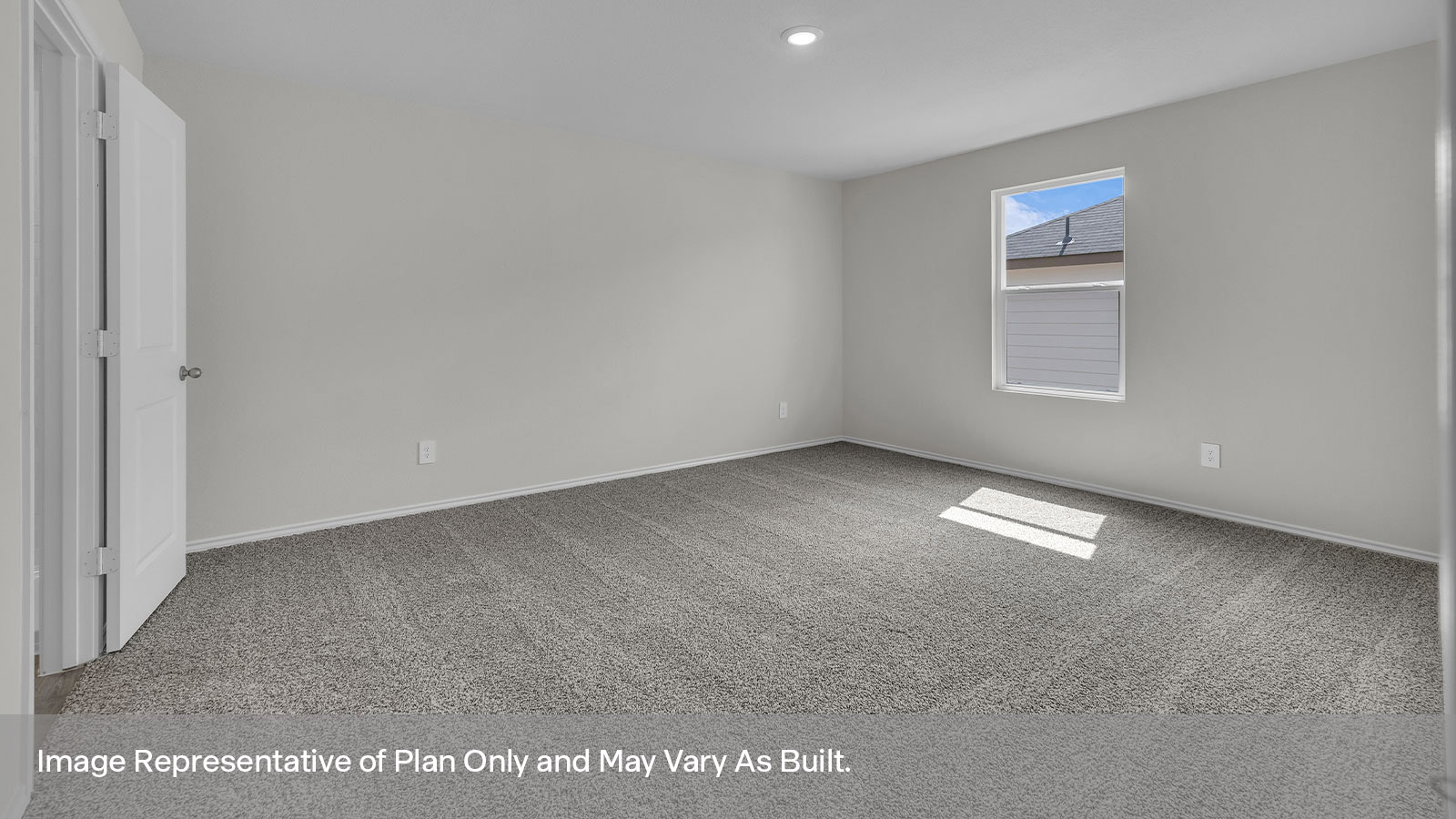 Main bedroom with carpeting and one window.