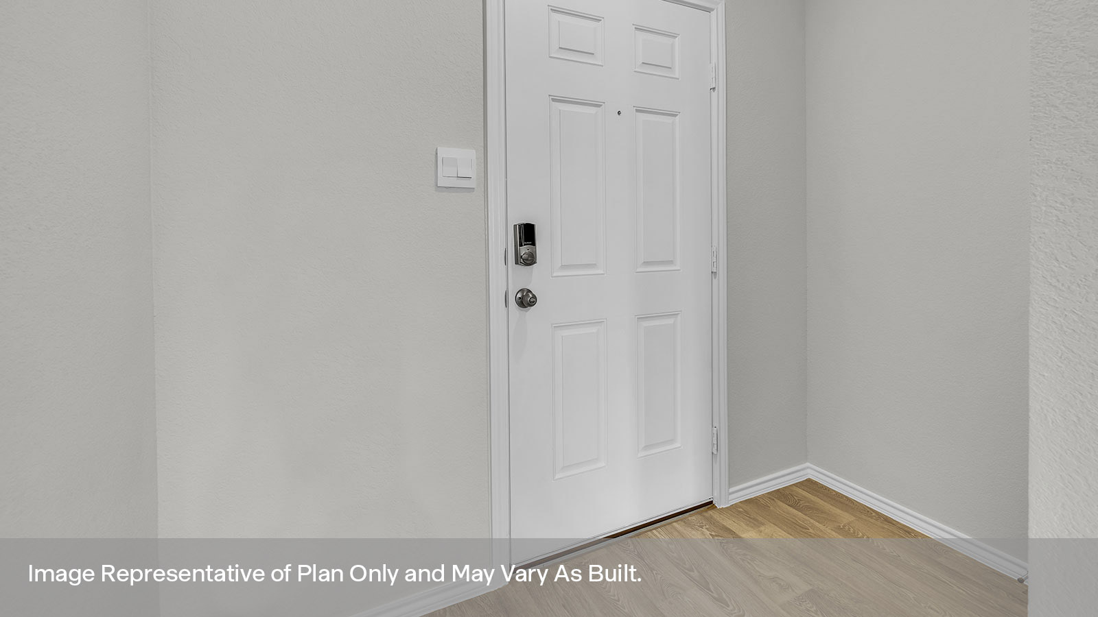 Entryway with vinyl flooring and front door.