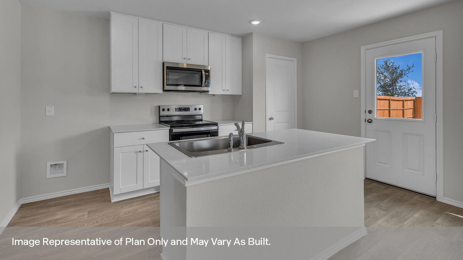 Kitchen with white cabinets and stainless steel cabinets.