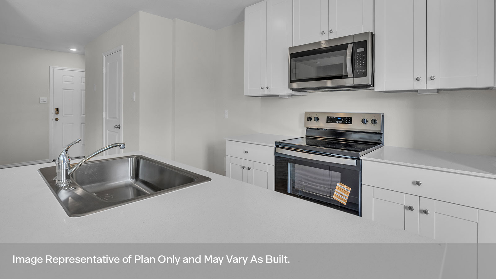 Kitchen with kitchen island and white cabinets.