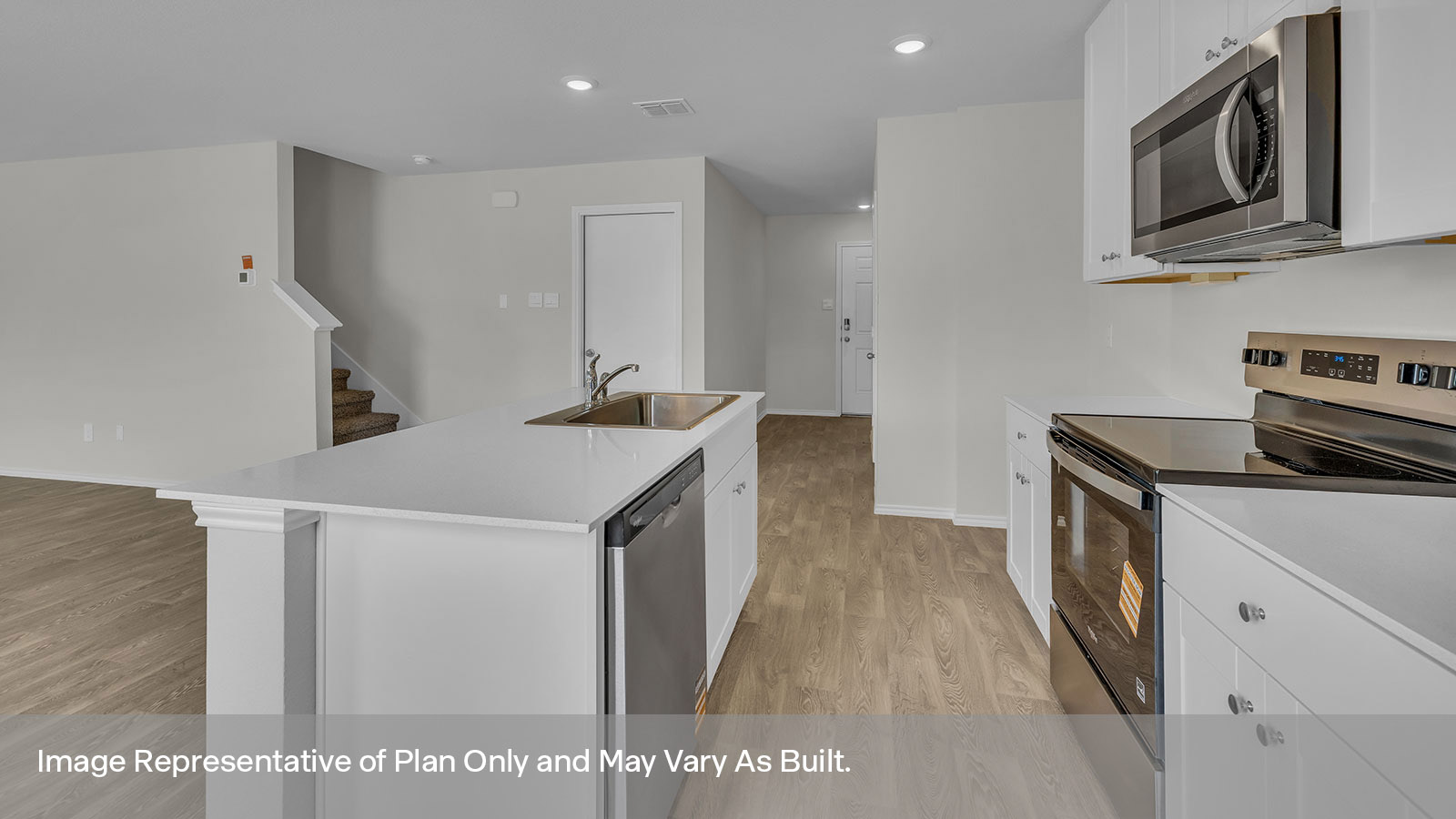 Kitchen with white cabinets and stainless steel appliances.