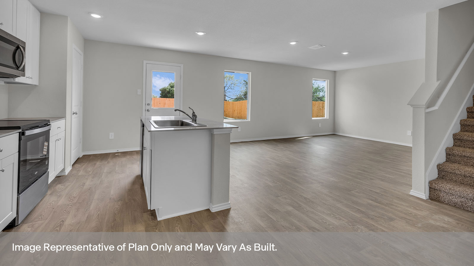 Kitchen with kitchen island overlooking the dining room.