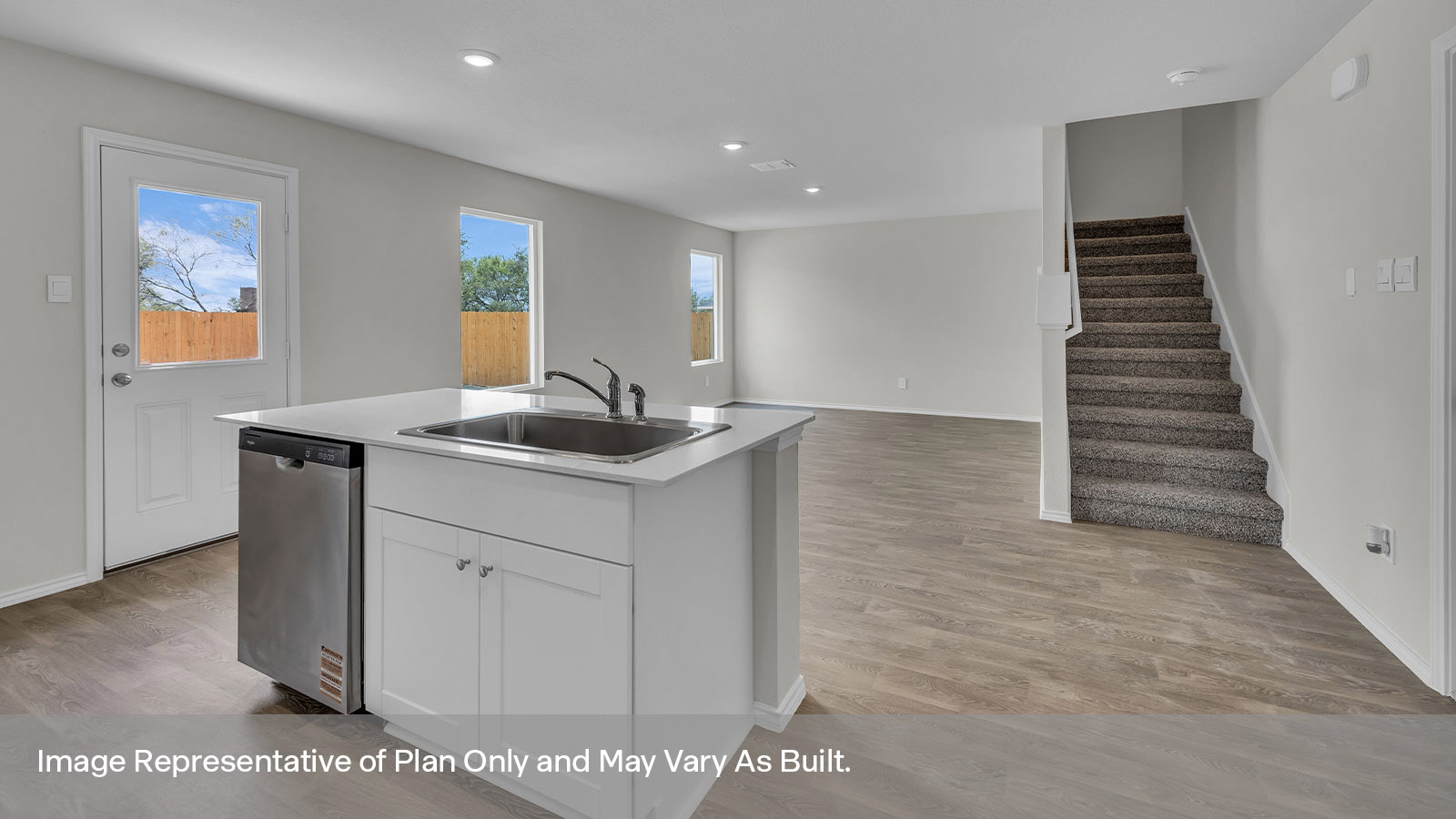 Kitchen with kitchen island overlooking the dining room.