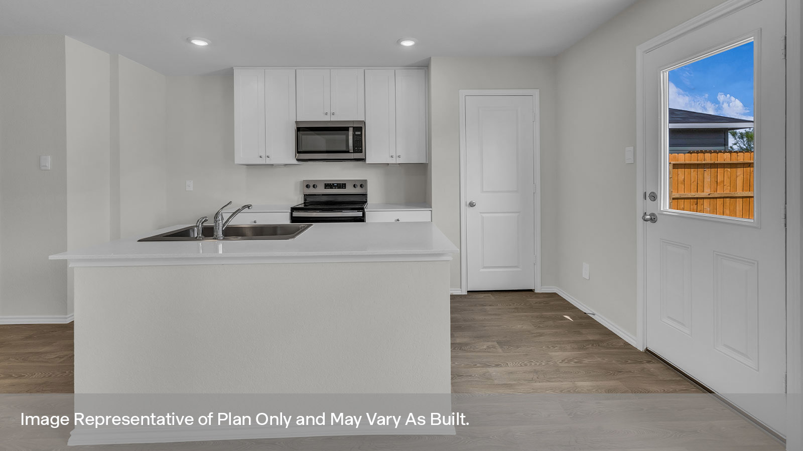 Kitchen with white cabinets and stainless steel appliances.