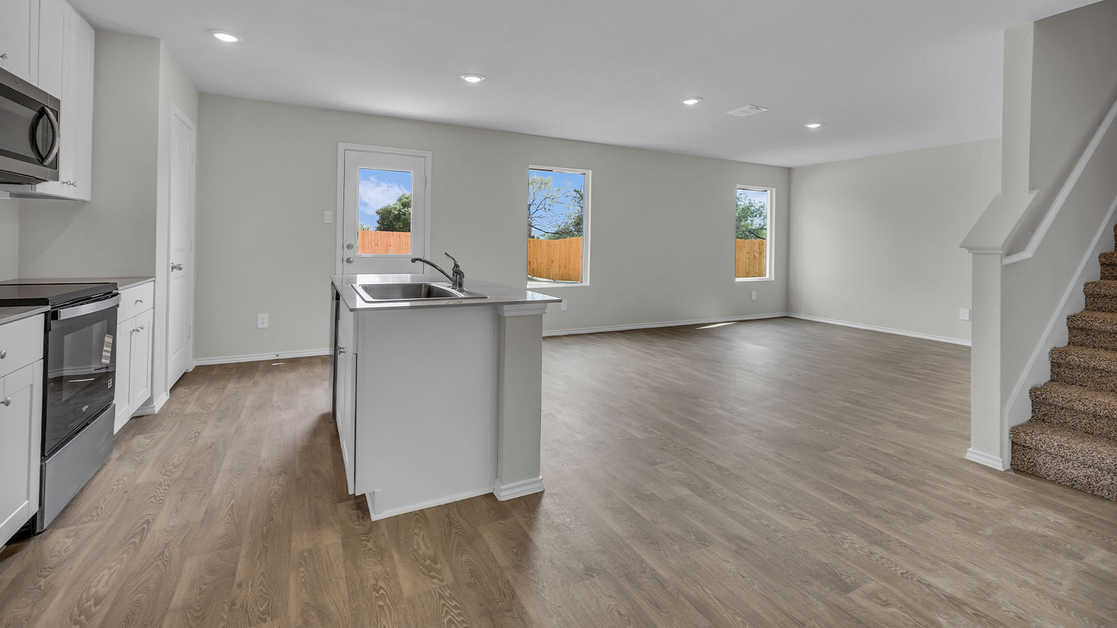 Kitchen with kitchen island overlooking the dining room.