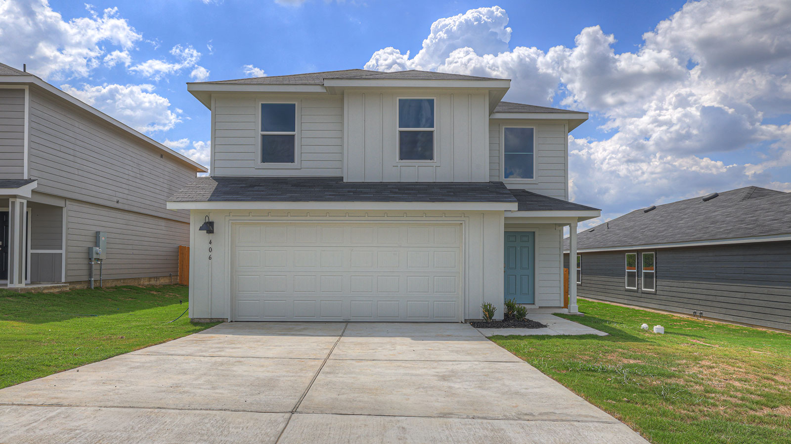 Davis floorplan with farmhouse exteriors and a 2 car garage.