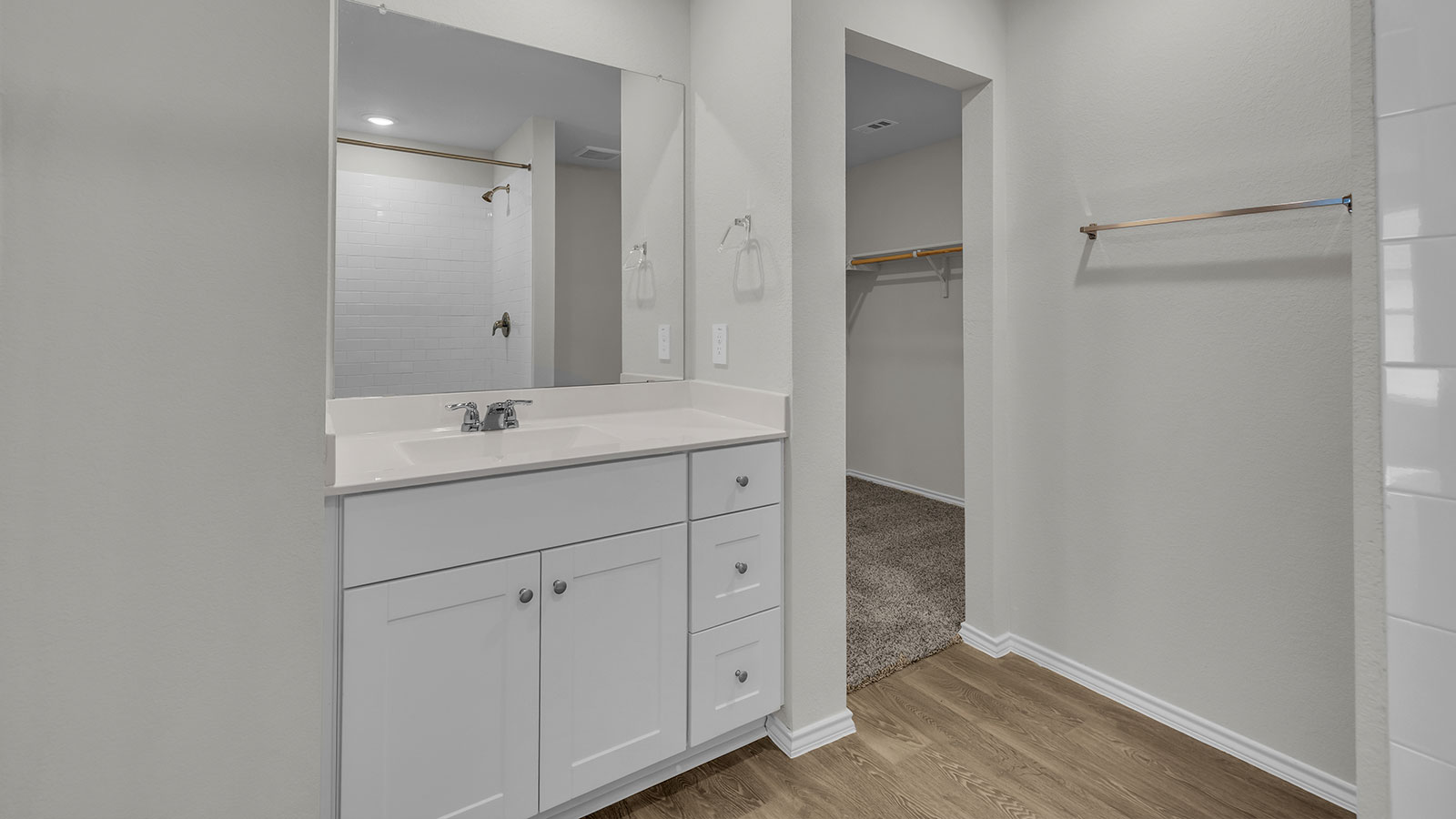 Main bathroom with single sink vanity.
