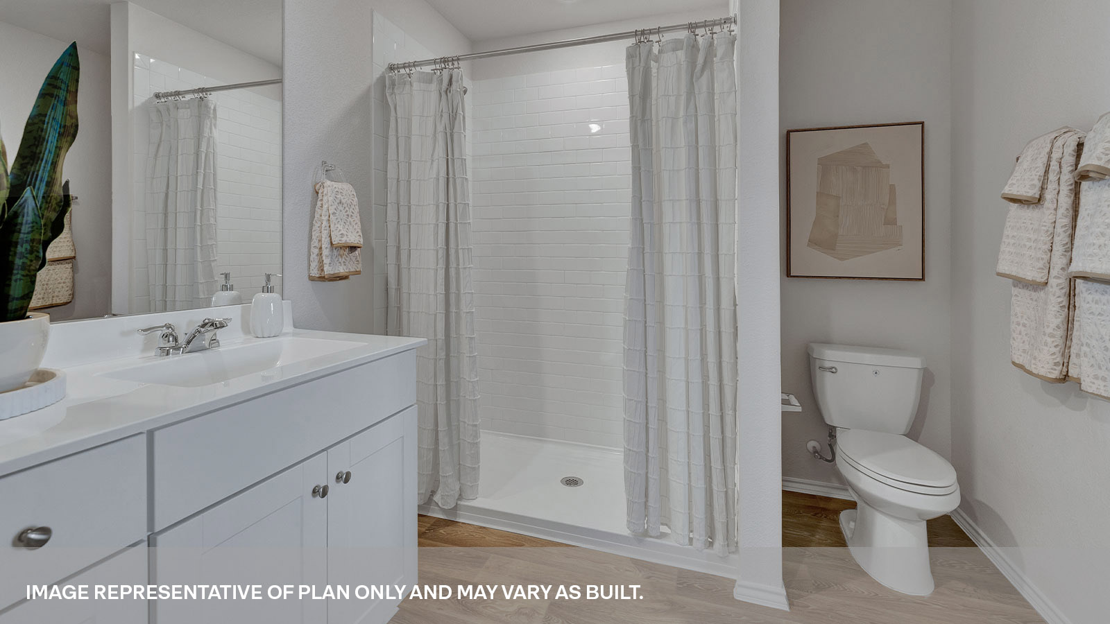 Main bathroom with shower, toilet, and sink.