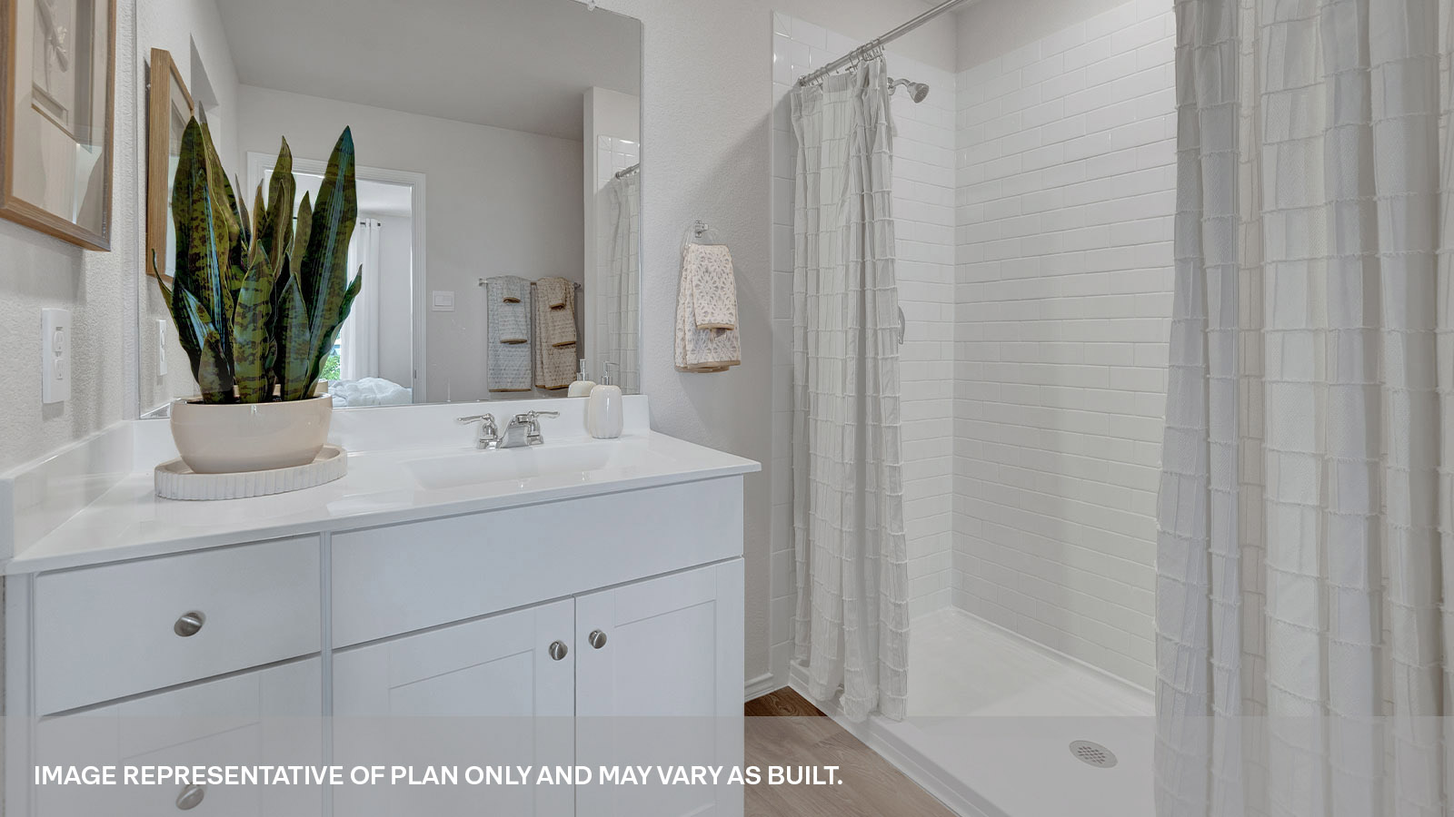 Main bathroom with shower, toilet, and sink.
