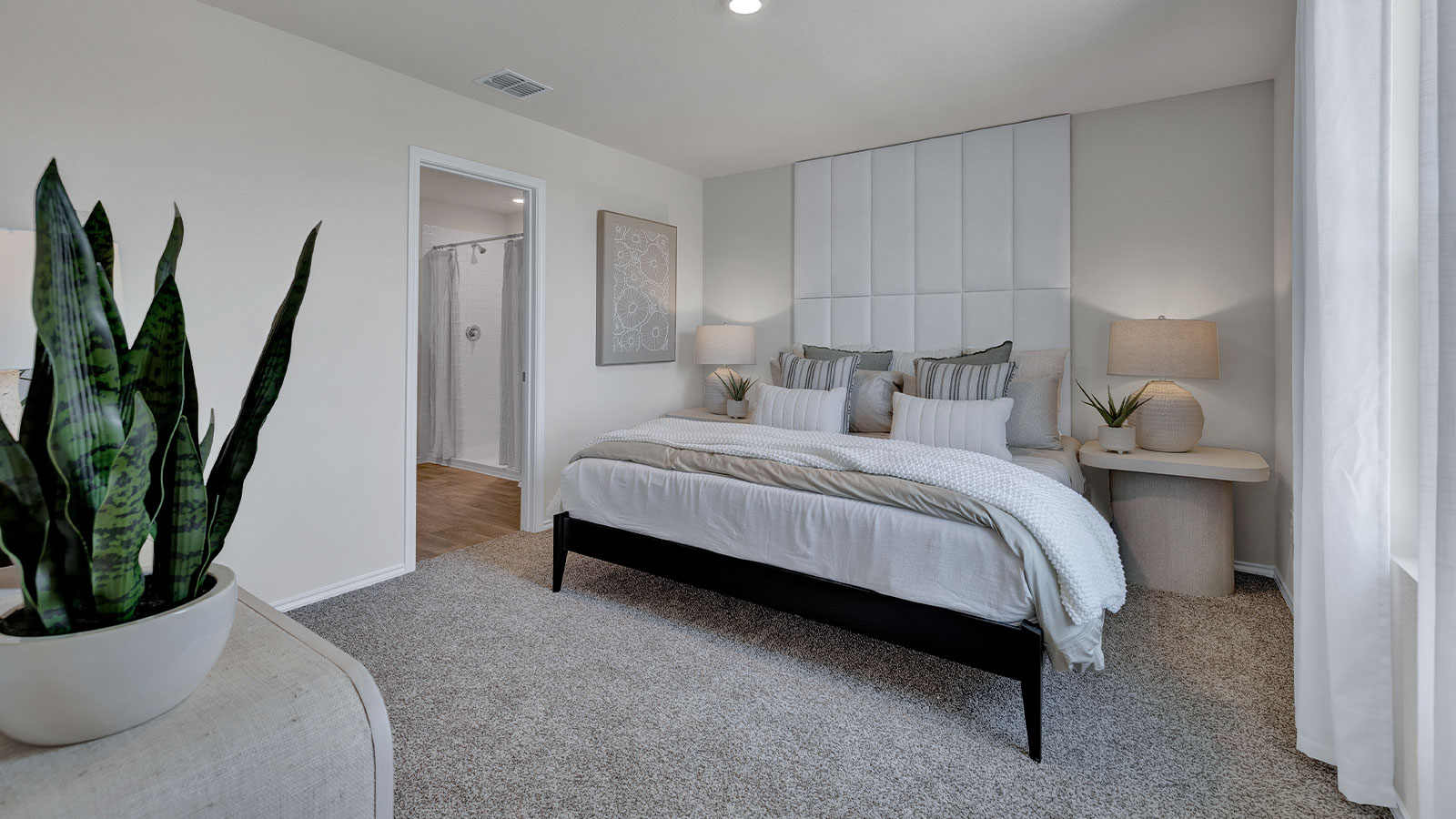 Main bedroom with carpeting and one window.