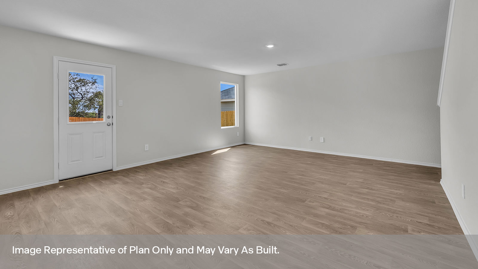 Living room with vinyl flooring, one window, and a half lite exterior door.