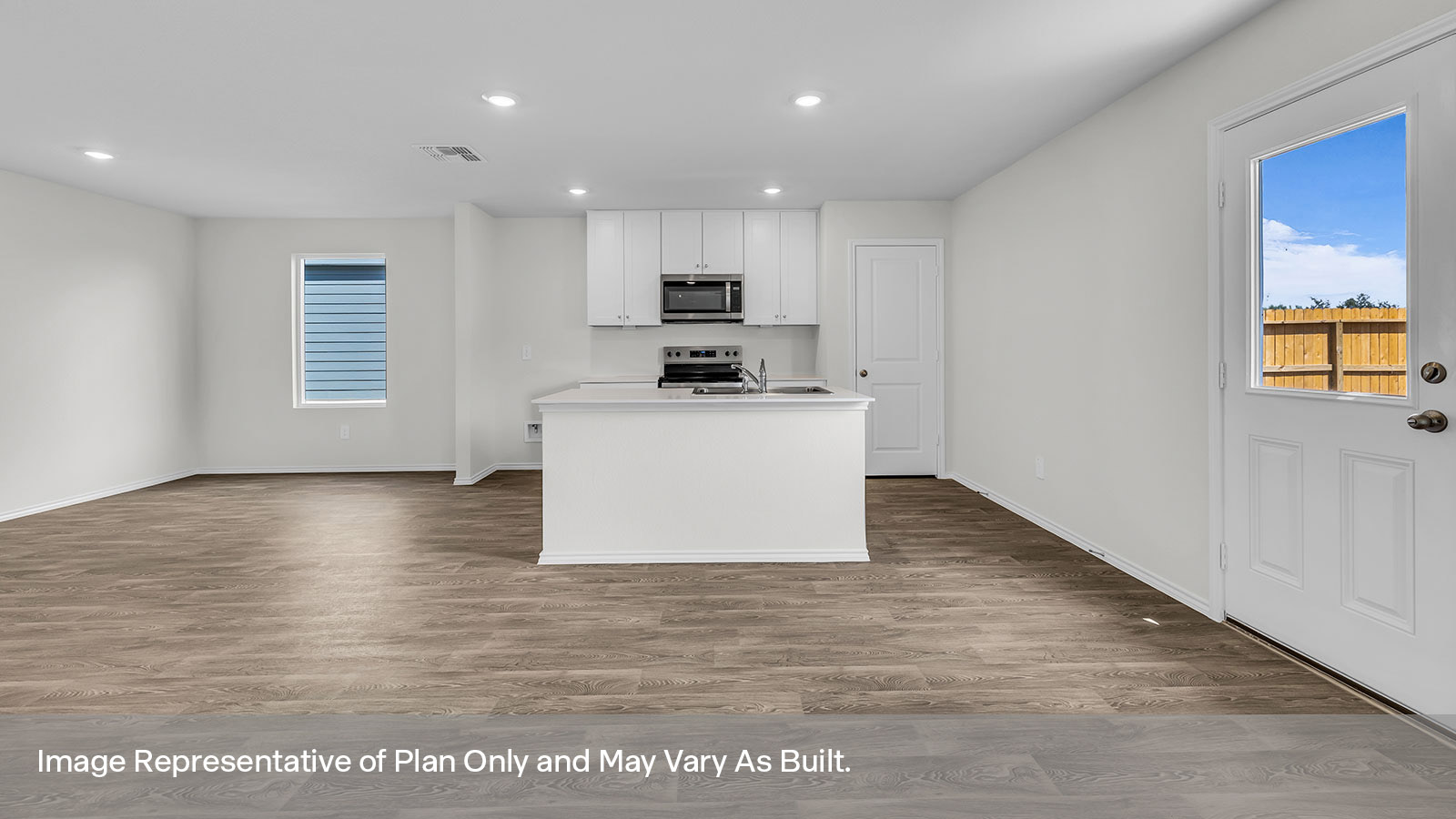 Kitchen with kitchen island and stainless steel appliances.