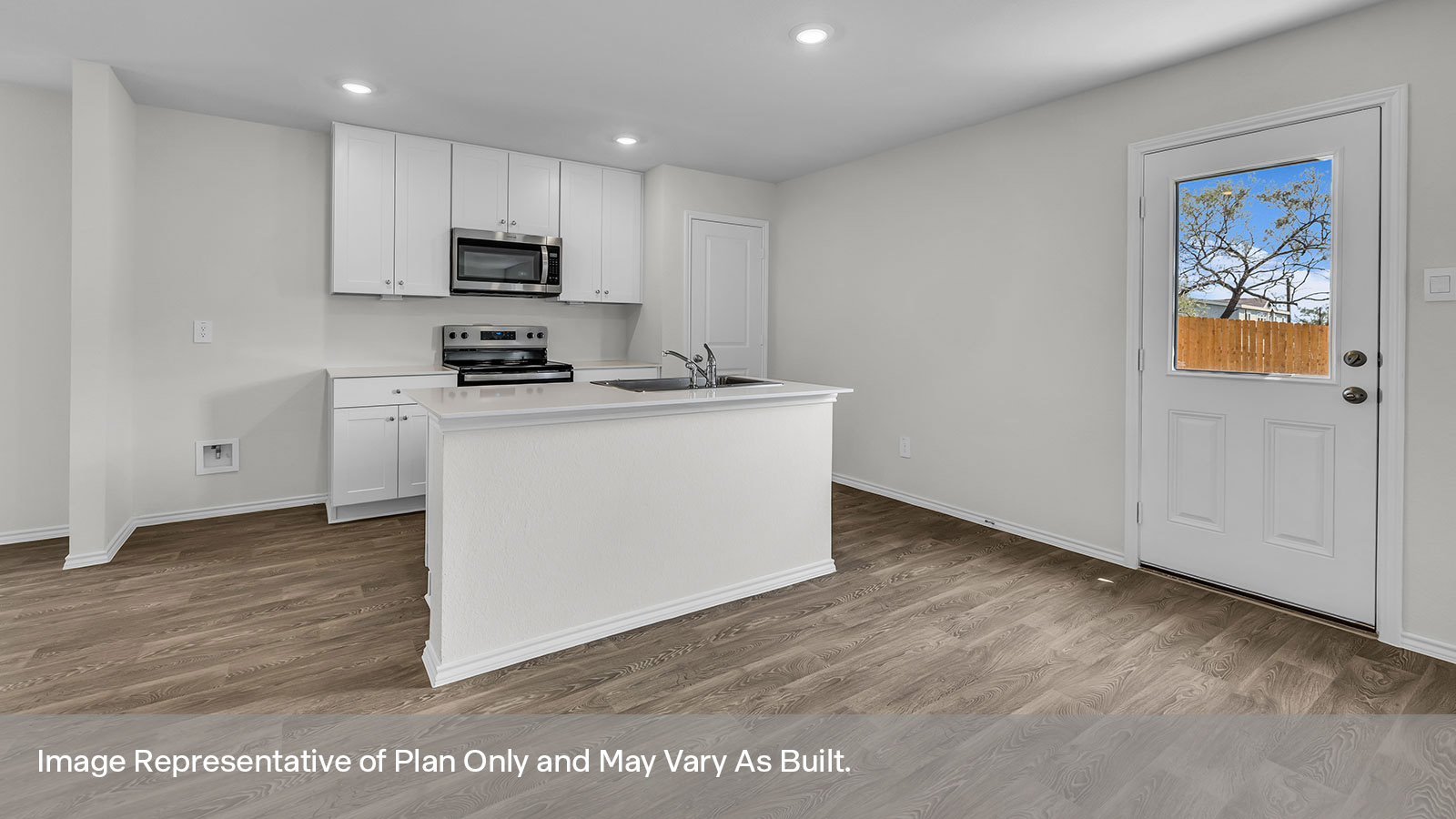 Kitchen with kitchen island and stainless steel appliances.
