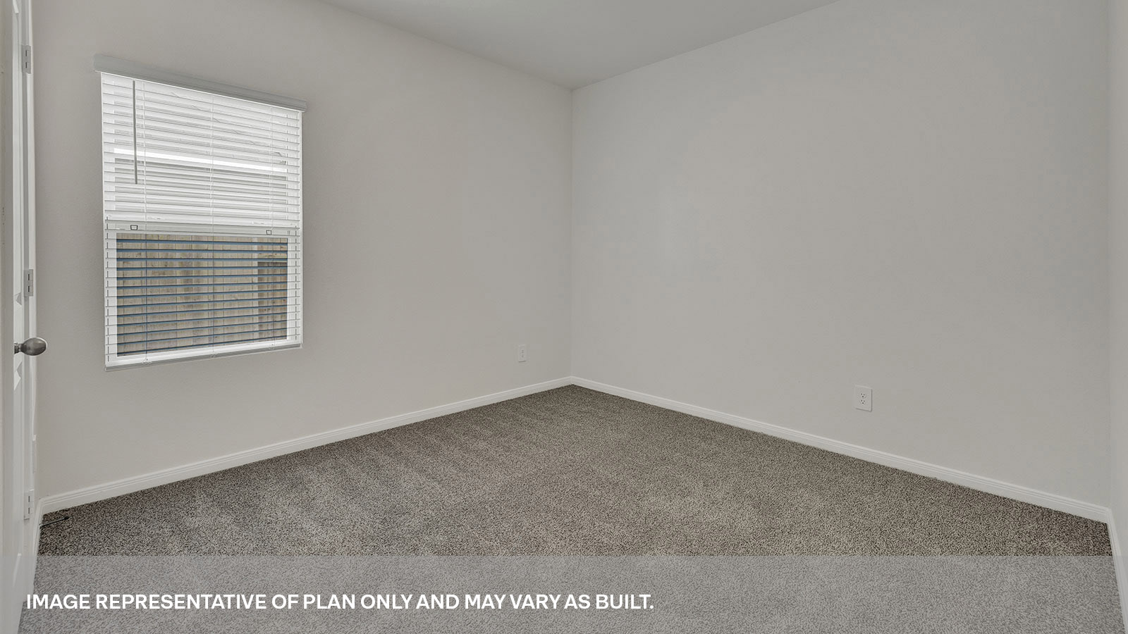 Front bedroom with carpeting and one window.