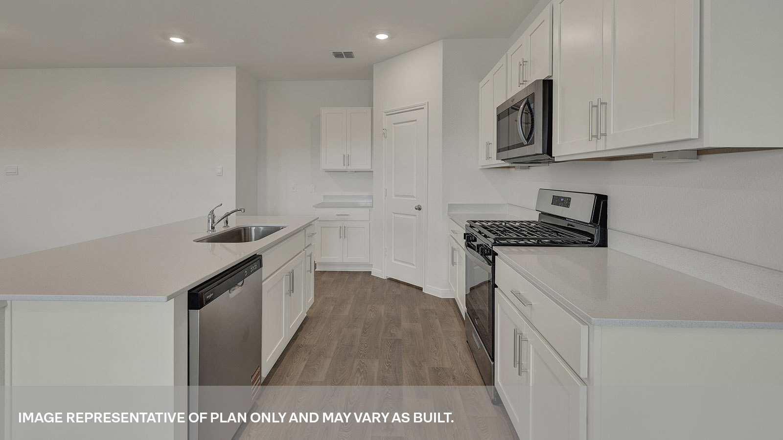 Kitchen with kitchen island and quartz countertops.