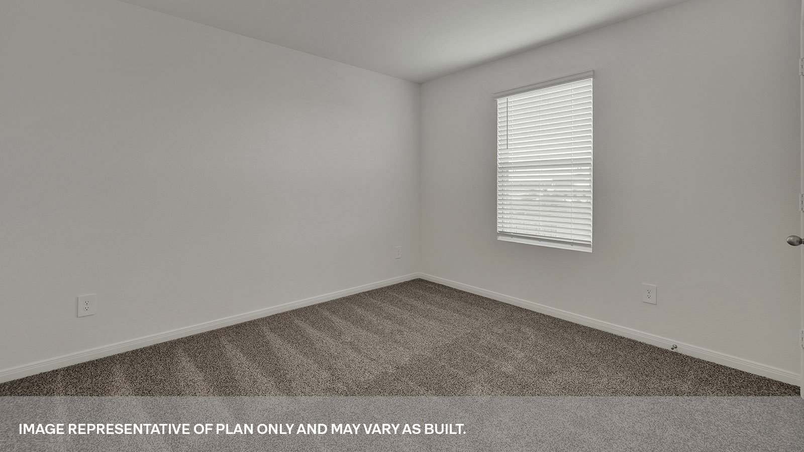 Bedroom with carpeting and one window.