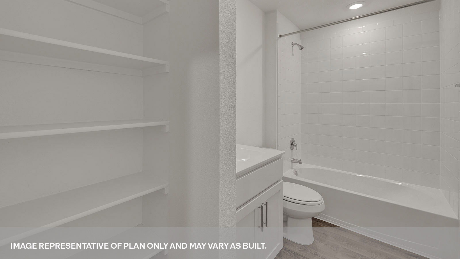 Hall bathroom with wooden shelving, toilet and tub.