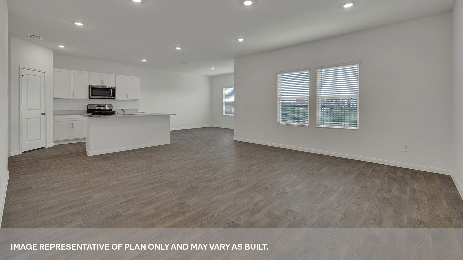 Living room with vinyl flooring and 2 windows.
