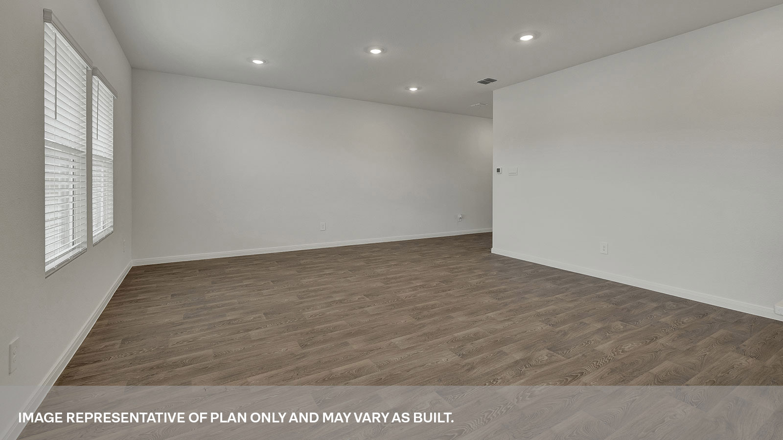 Living room with vinyl flooring and entry hallway.