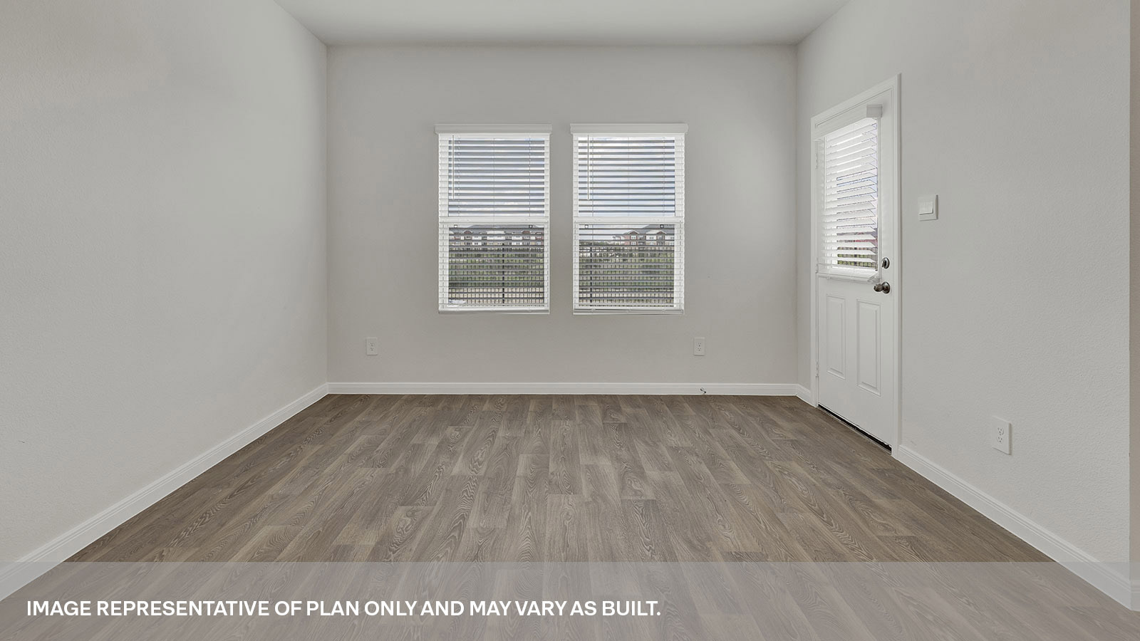 Dining room with vinyl flooring and two windows.