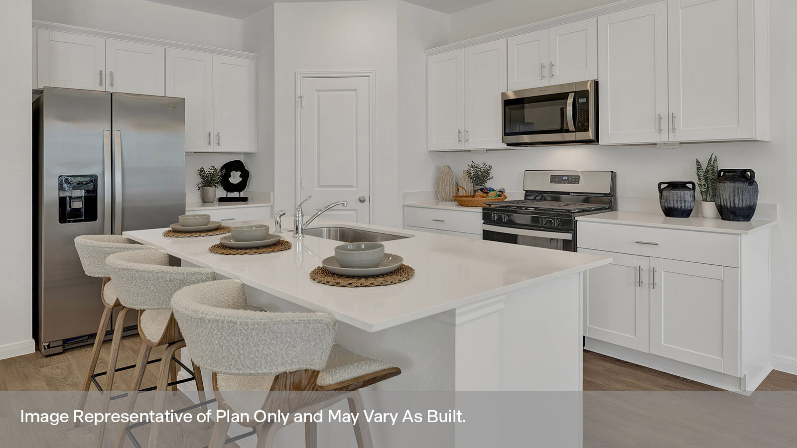 Kitchen with kitchen island and quartz countertops.